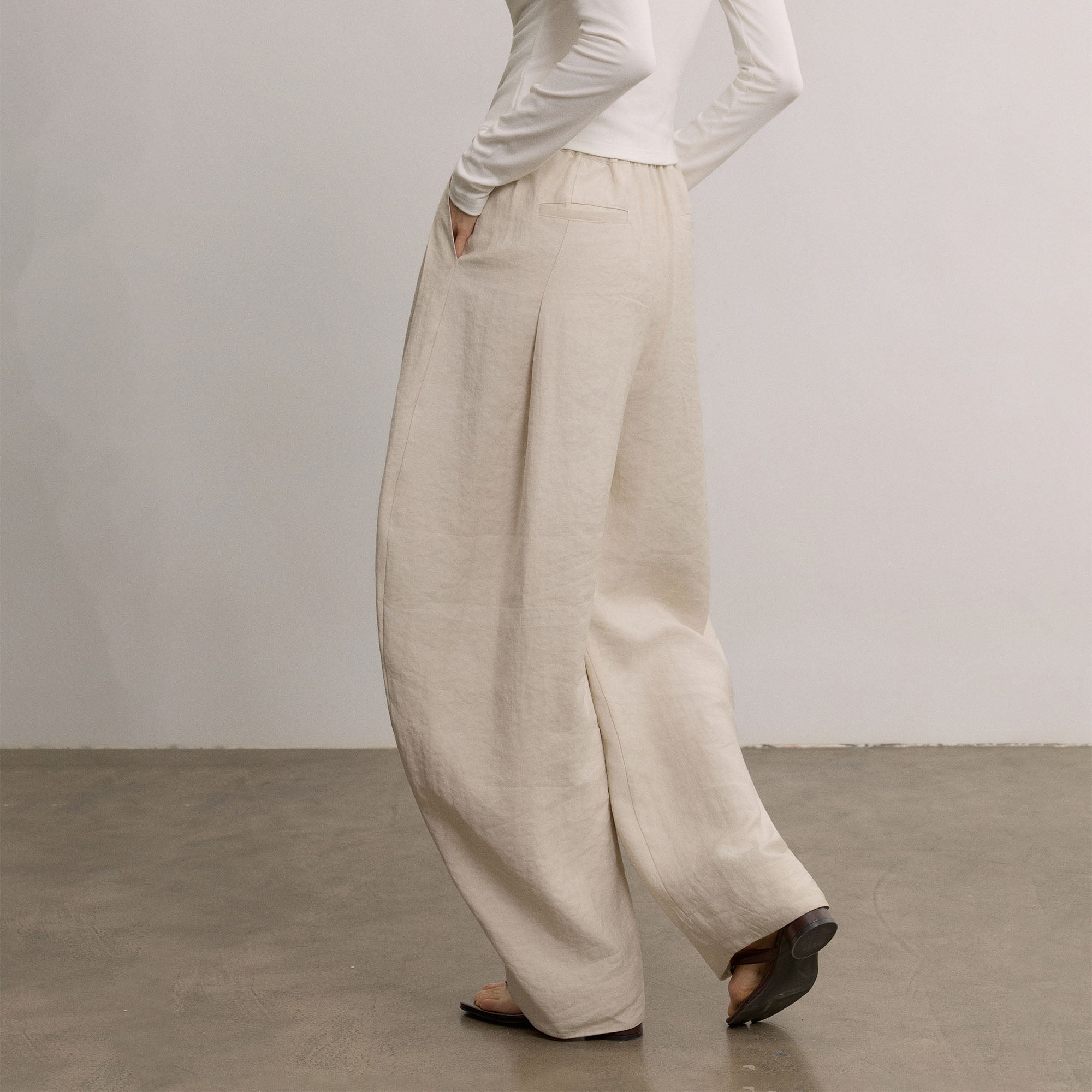 SAME FLOW Belted Pleated Oversized Barrel Pants