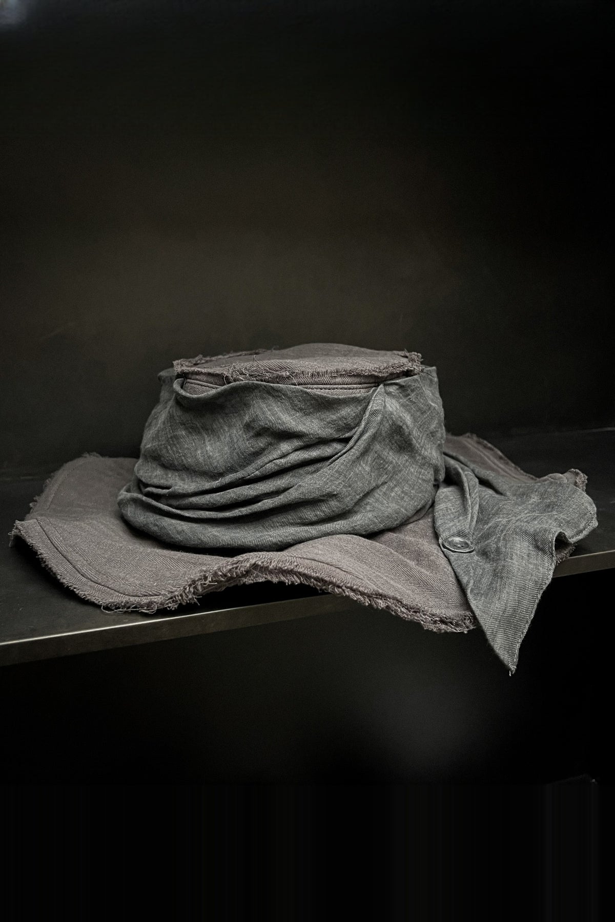 ILNya Nieternite Nifutur Frayed Raw-Edge Wide-Brim Structured Flat Top Hat — flat lay