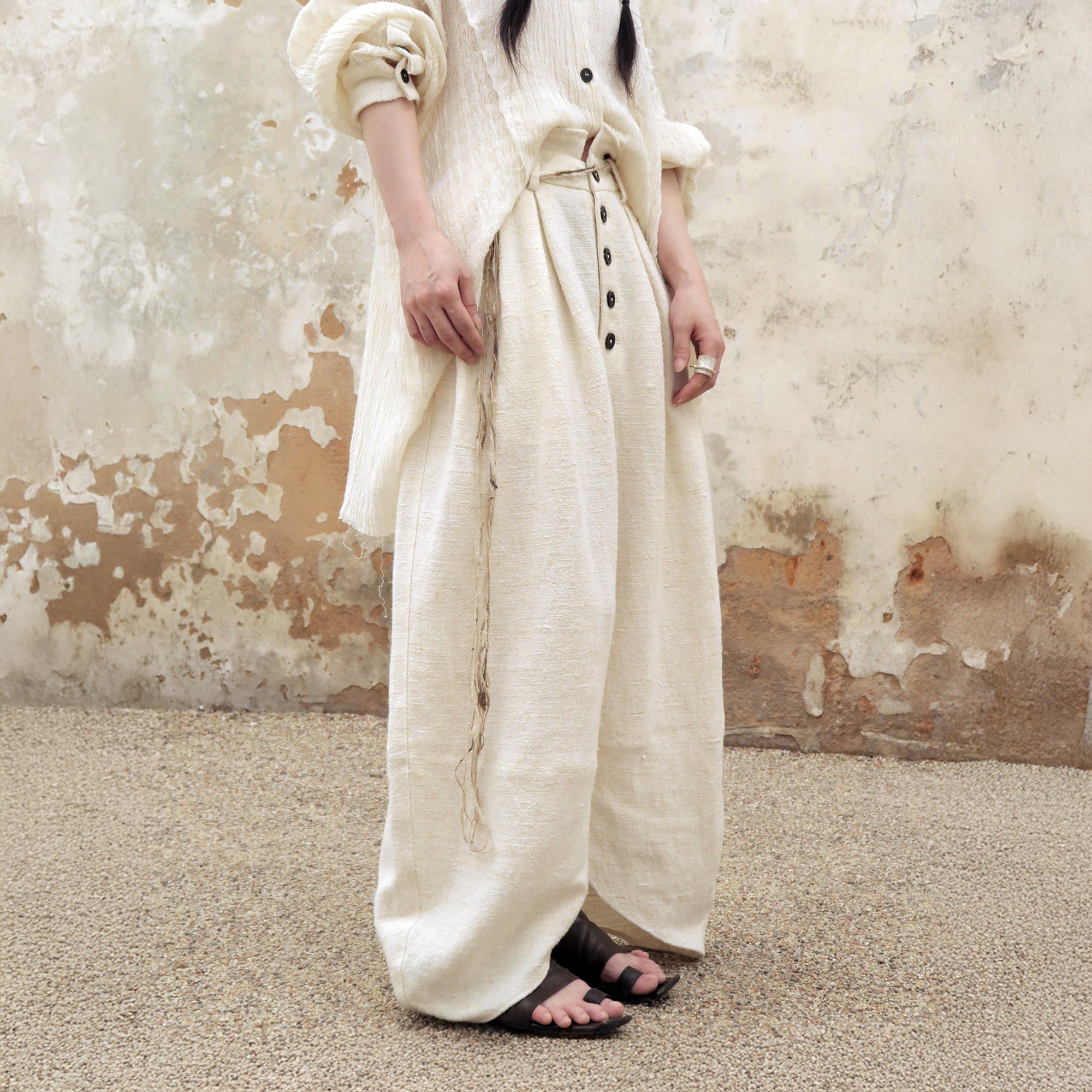 INCH LIM Pleated Split-Hem Curved-Leg Pants