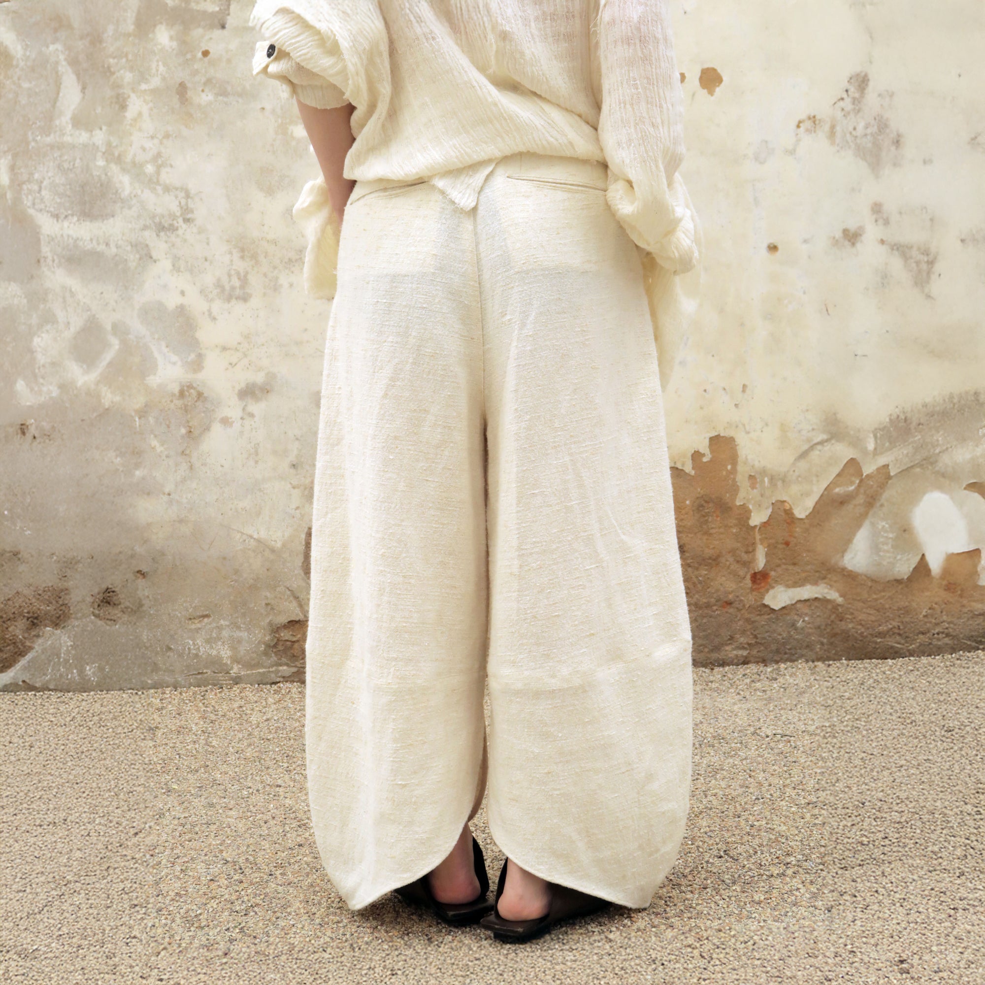 INCH LIM Pleated Split-Hem Curved-Leg Pants
