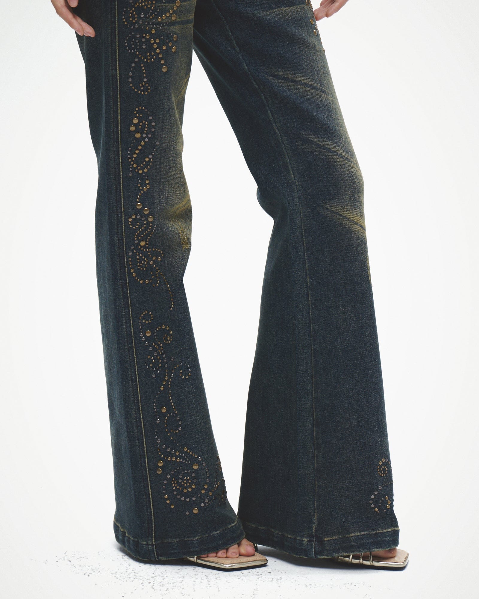 FAYCHUI Distressed Rivet Embellished Flared Jeans