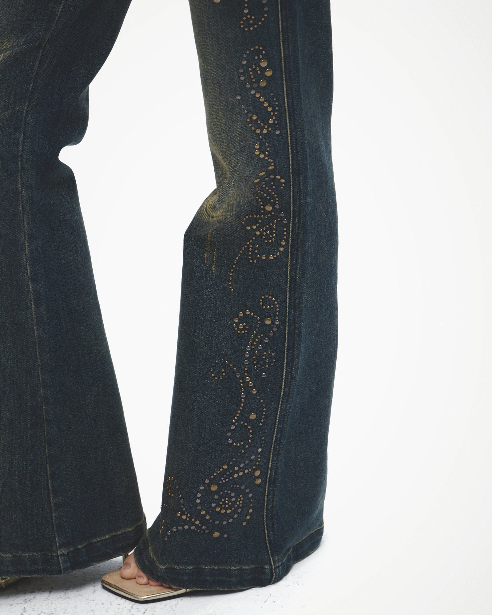 FAYCHUI Distressed Rivet Embellished Flared Jeans