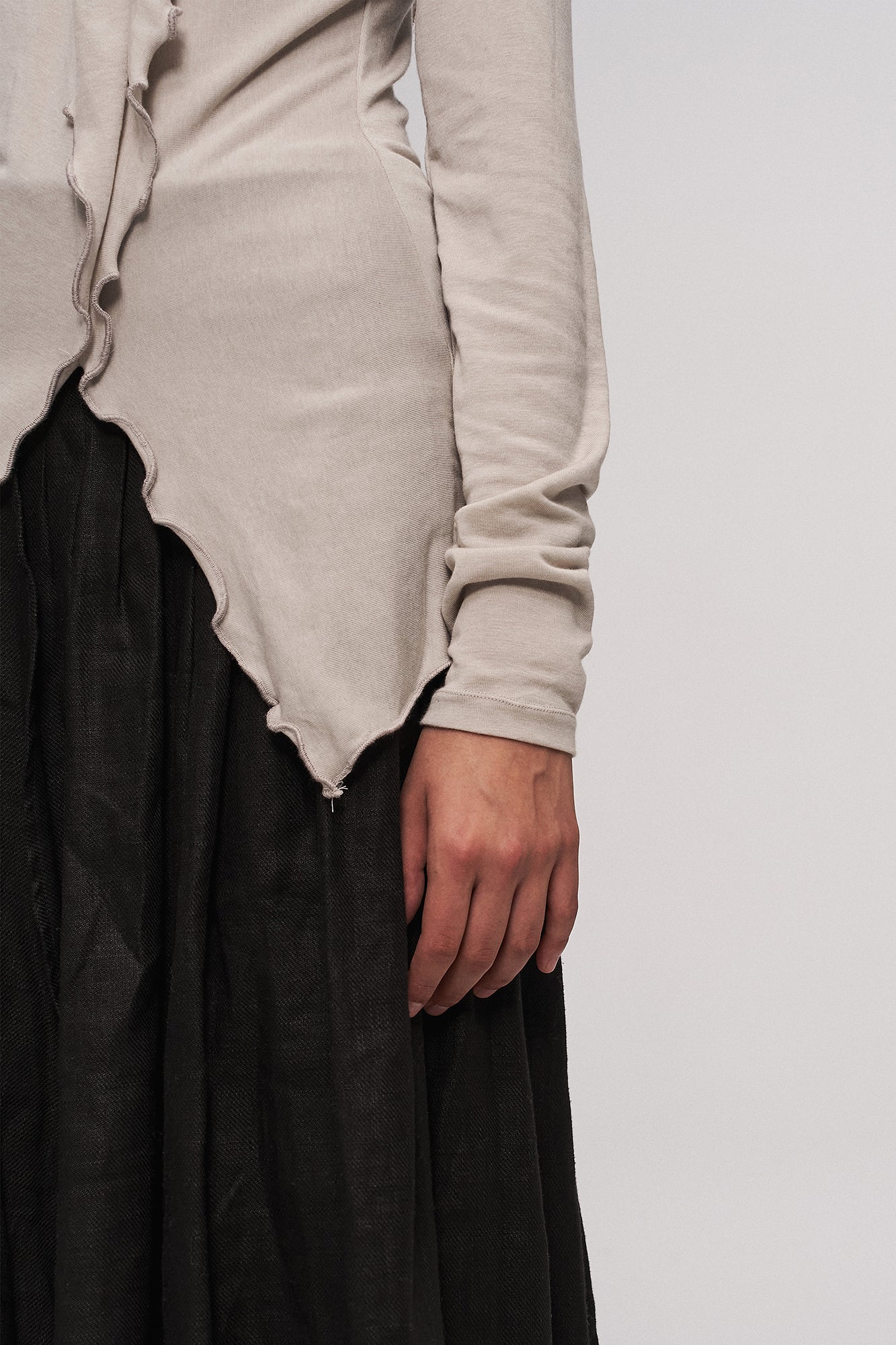 ILNya Nieternite Nifutur Asymmetrical Ruffle Wool-Blend Long Sleeve Tee