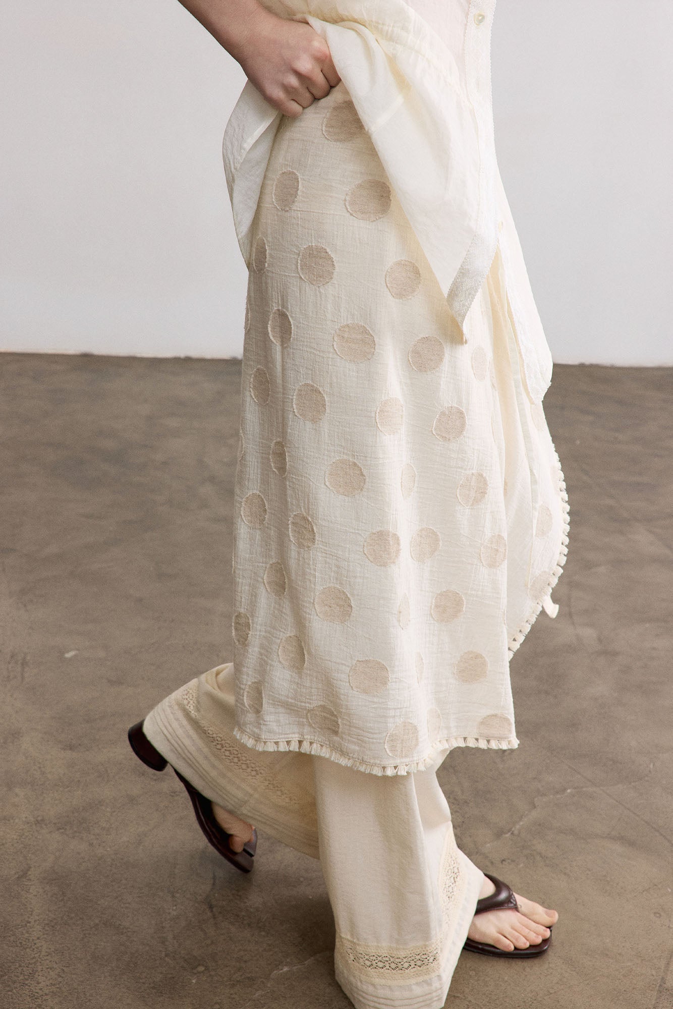 SAME FLOW Asymmetrical Dot Fringe-Trim Tie Skirt
