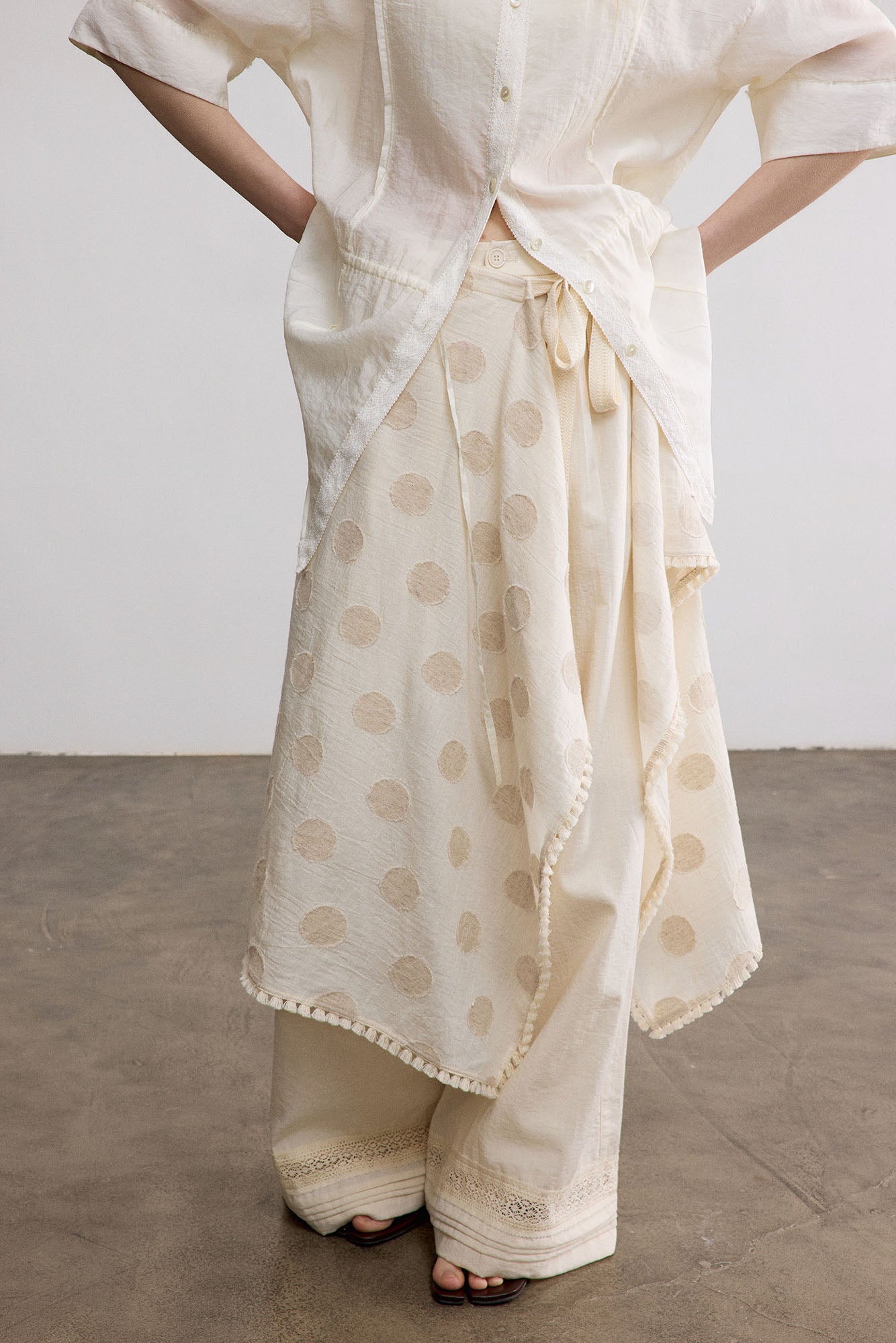 SAME FLOW Asymmetrical Dot Fringe-Trim Tie Skirt