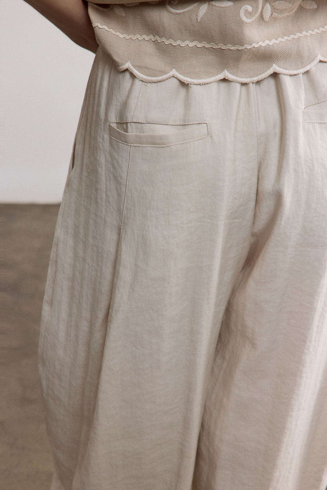 SAME FLOW Belted Pleated Oversized Barrel Pants