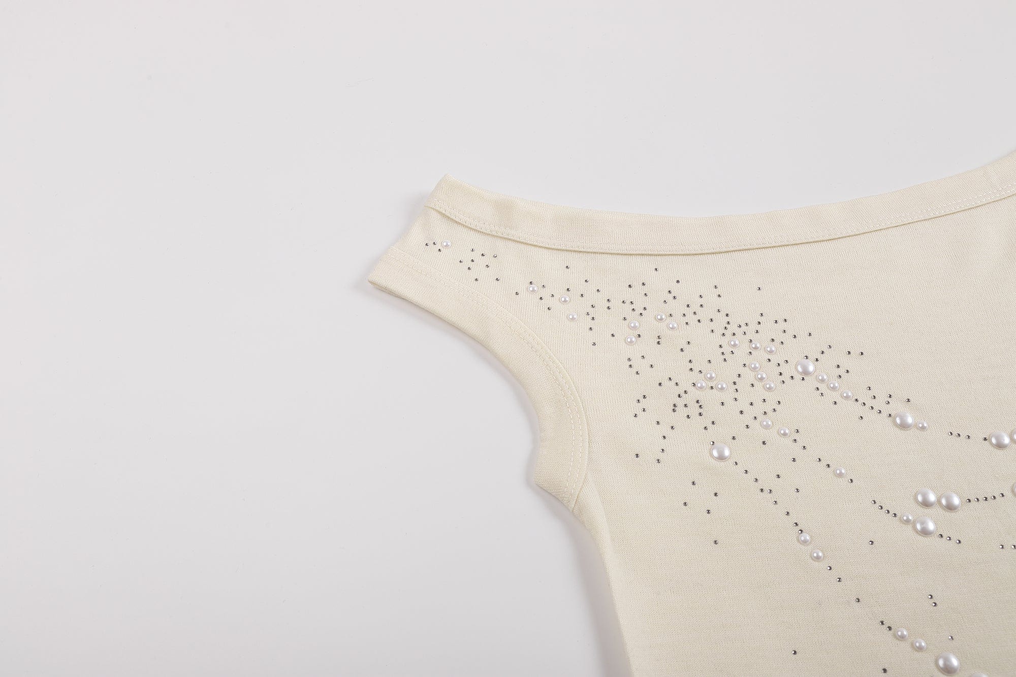 FAYCHUI Asymmetrical Pearl Studded Tank Top