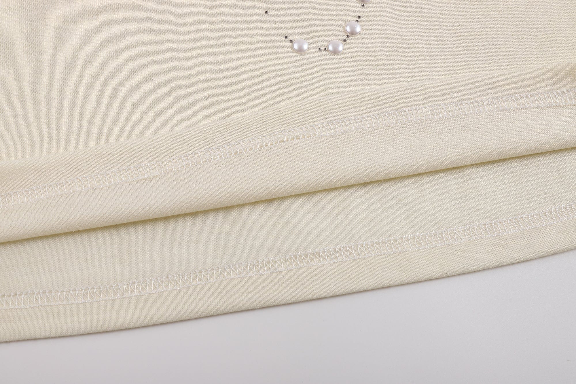 FAYCHUI Asymmetrical Pearl Studded Tank Top