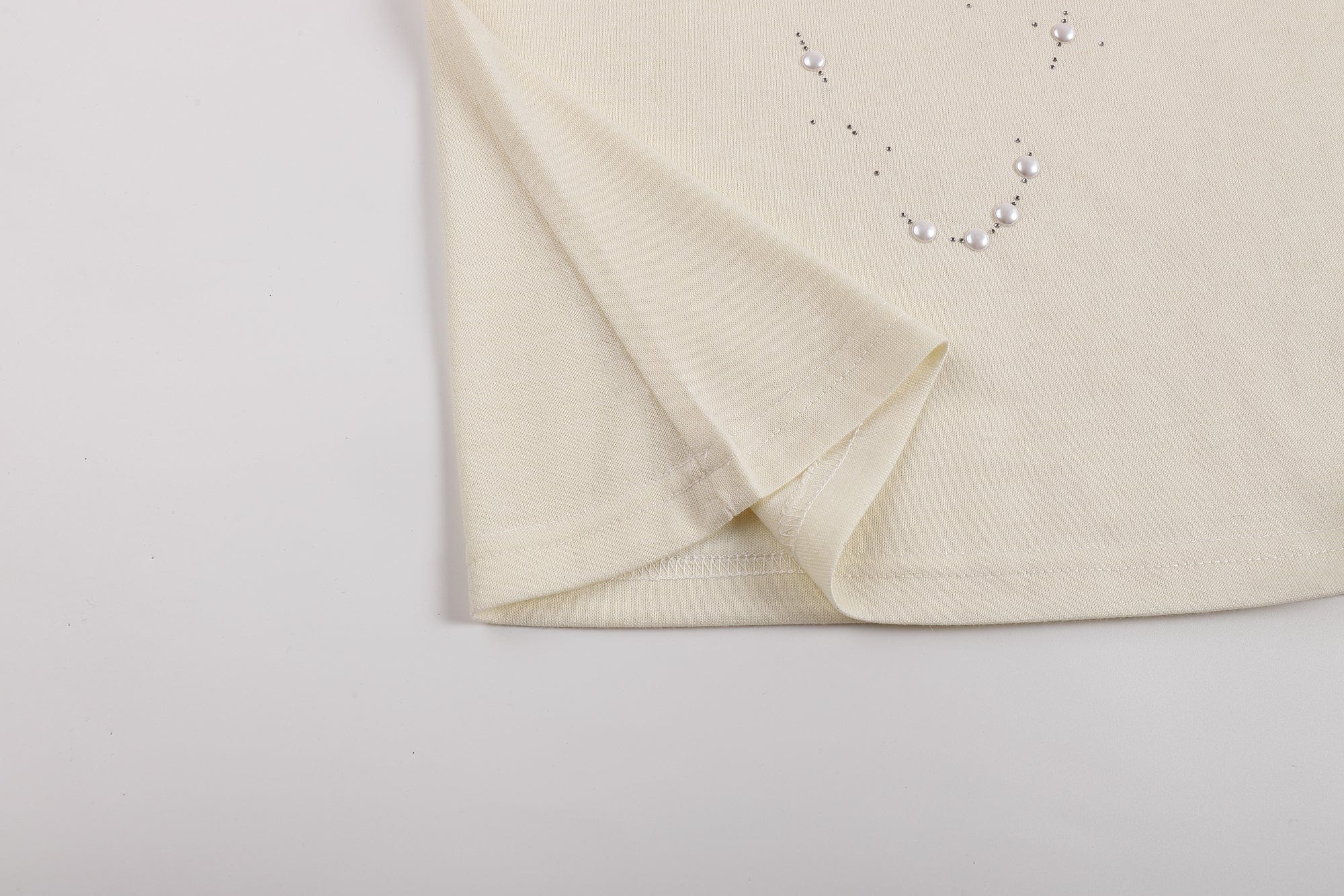 FAYCHUI Asymmetrical Pearl Studded Tank Top