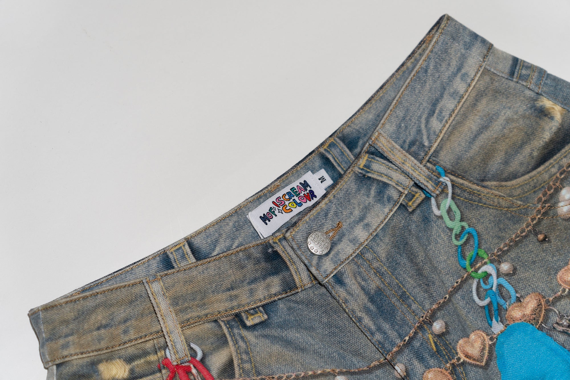MOF Teddy Chain Graphic Distressed Curved Jeans