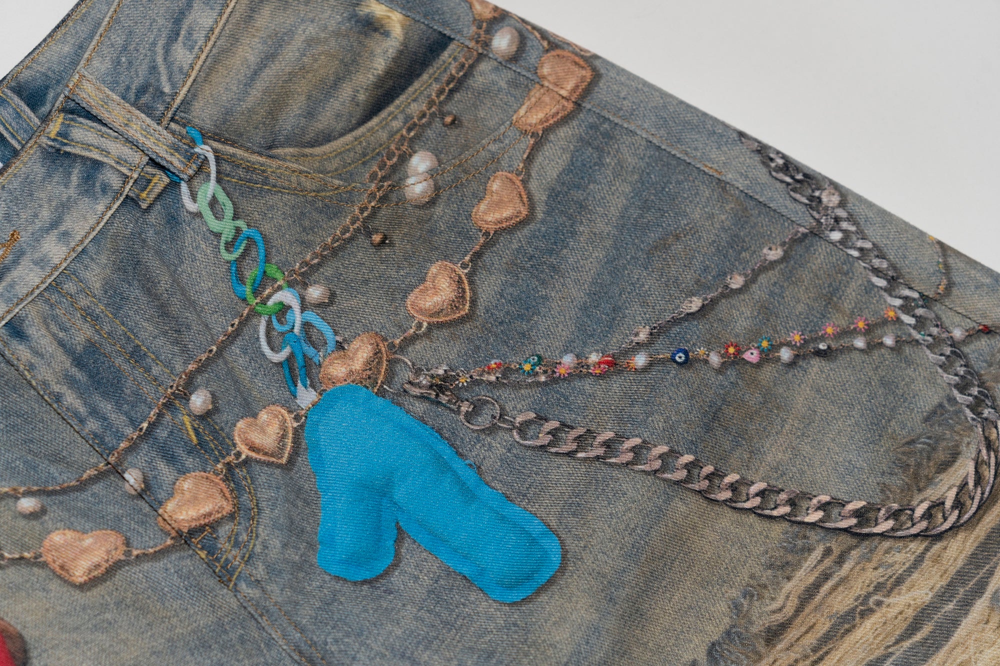 MOF Teddy Chain Graphic Distressed Curved Jeans