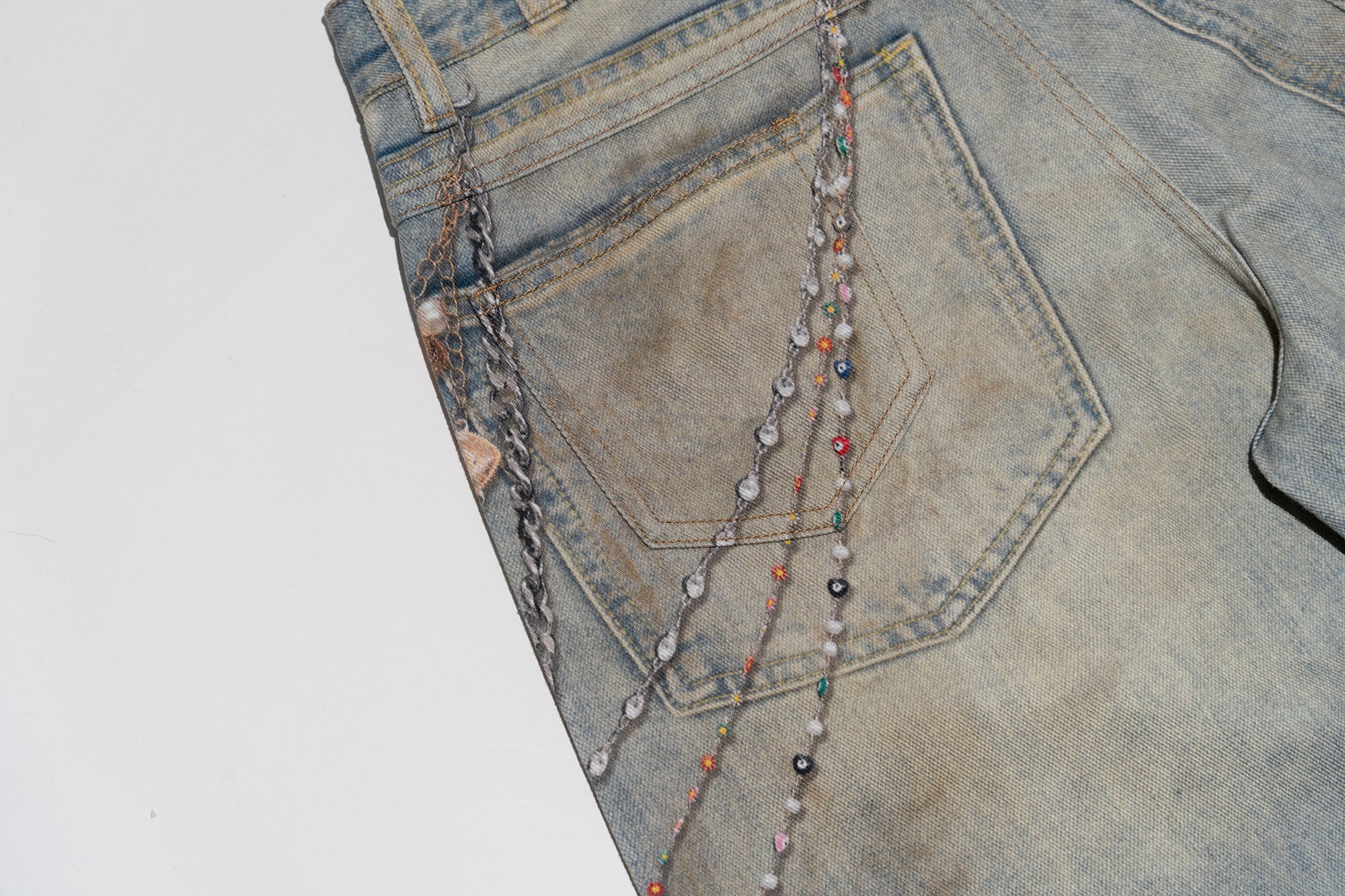 MOF Teddy Chain Graphic Distressed Curved Jeans