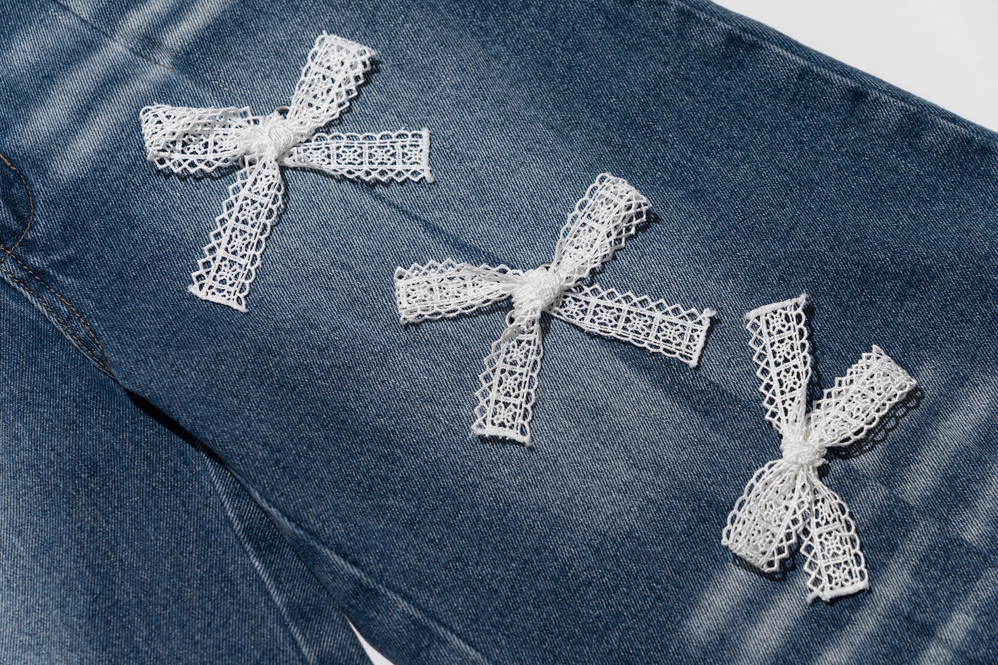 MOF Lace Bow Wide-Leg Cropped Jeans