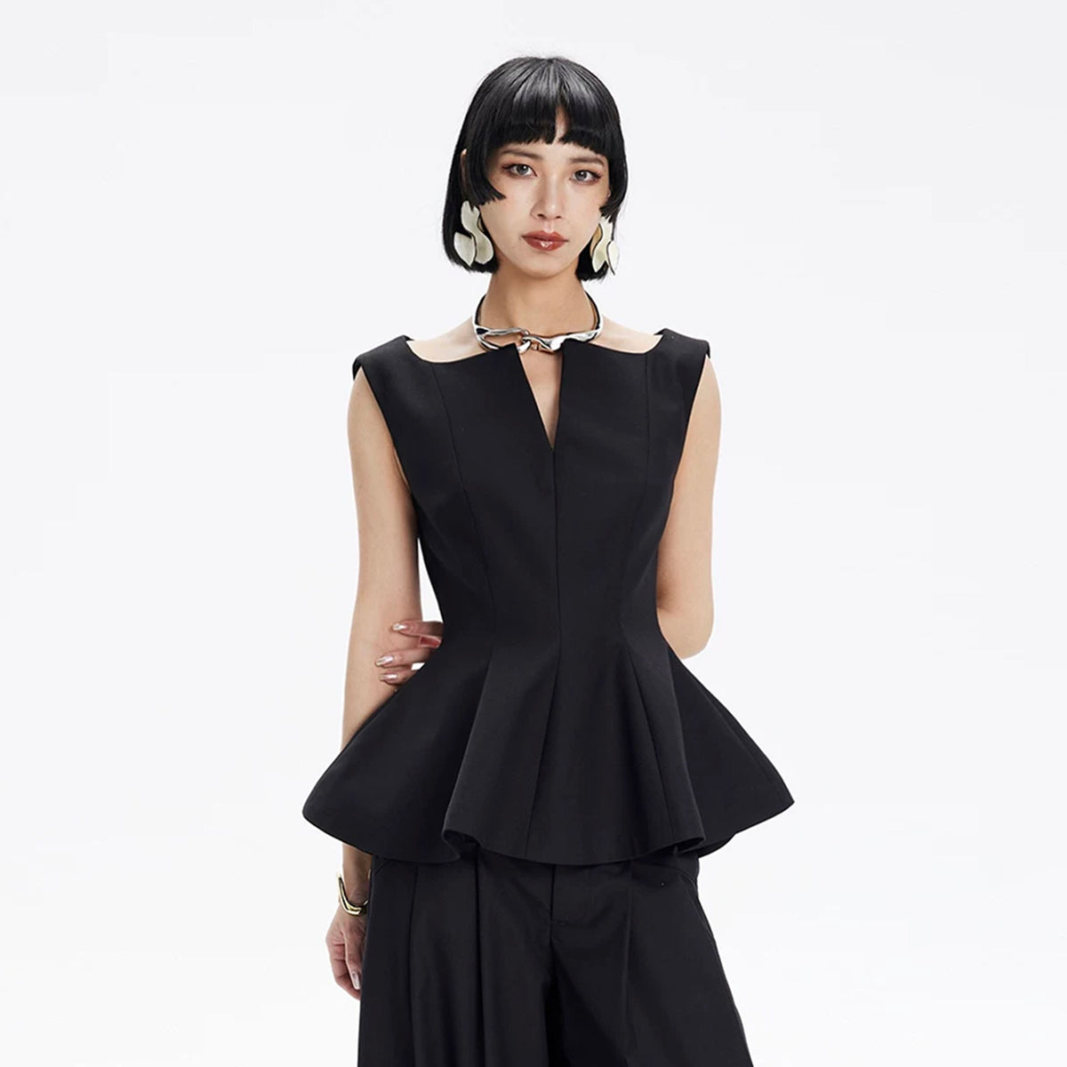 TINY IN STUDIO Sculptural Flared-Hem Tank Top