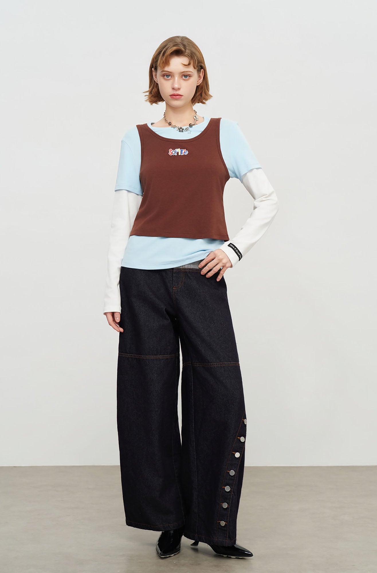 SOFITTE Contrast Waistband Asym Button Seam Raw Jeans
