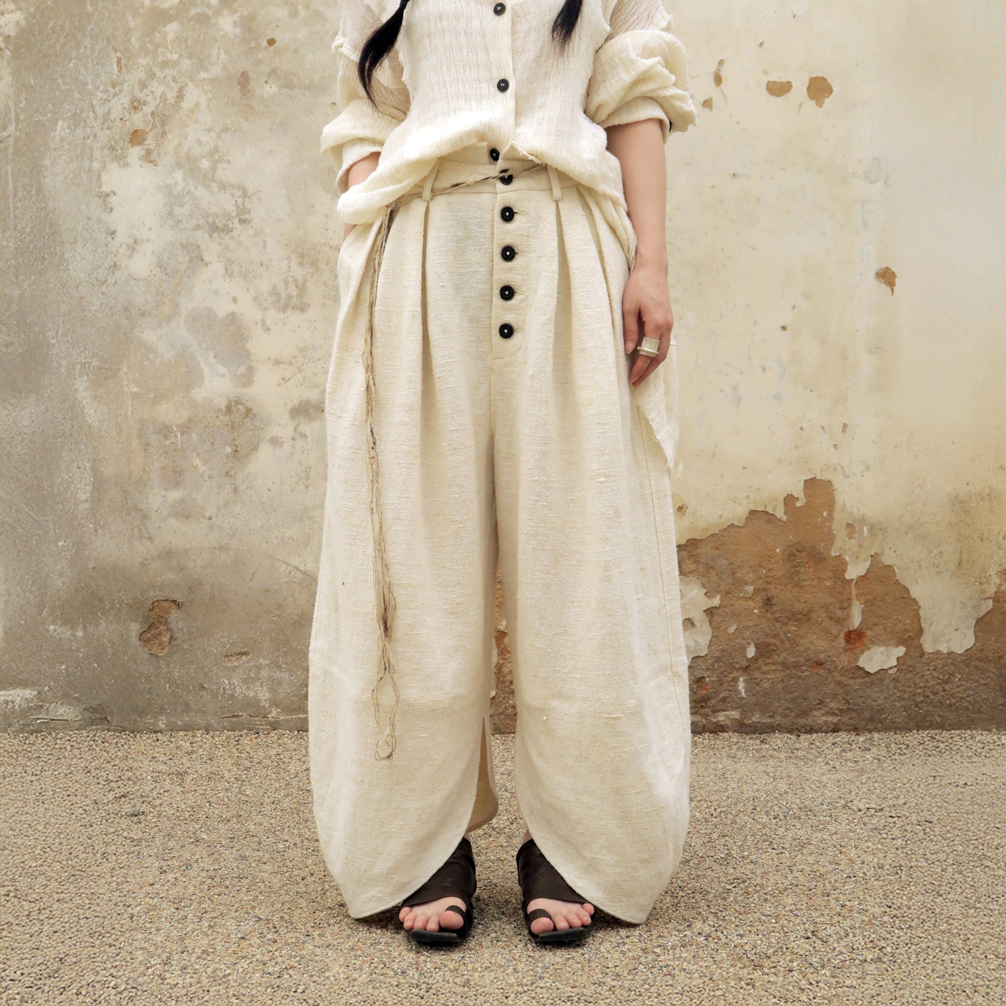 INCH LIM Pleated Split-Hem Curved-Leg Pants