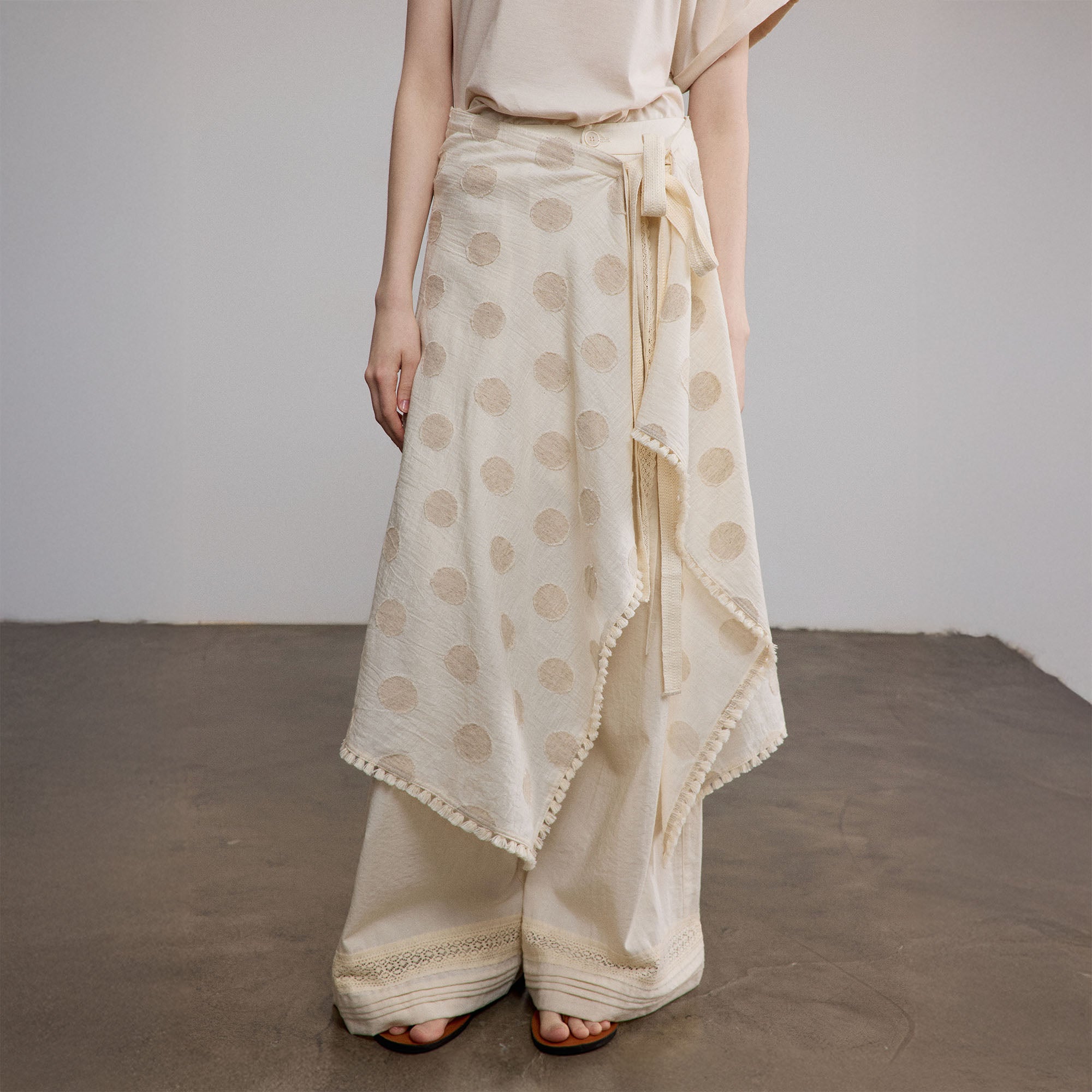 SAME FLOW Asymmetrical Dot Fringe-Trim Tie Skirt