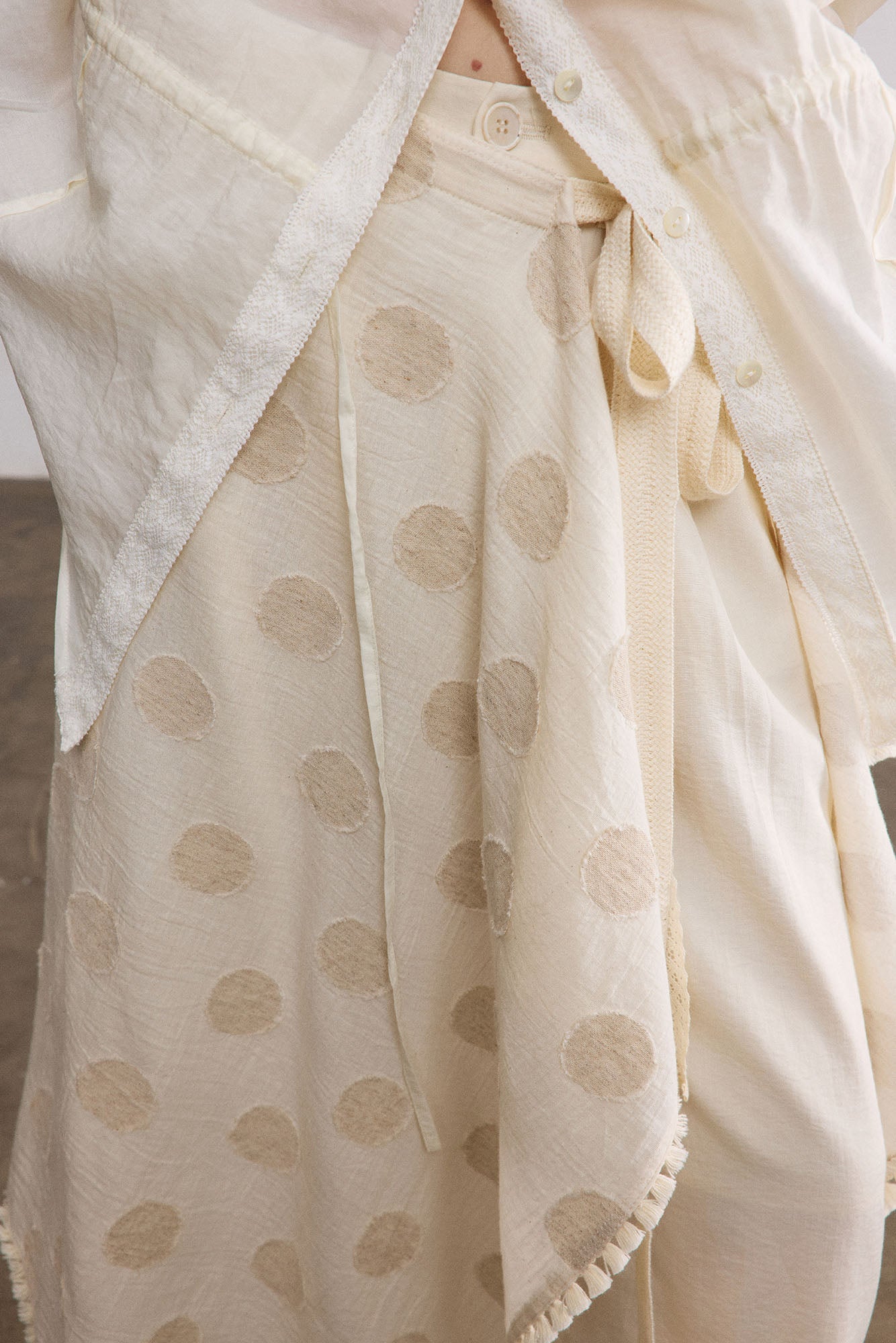 SAME FLOW Asymmetrical Dot Fringe-Trim Tie Skirt