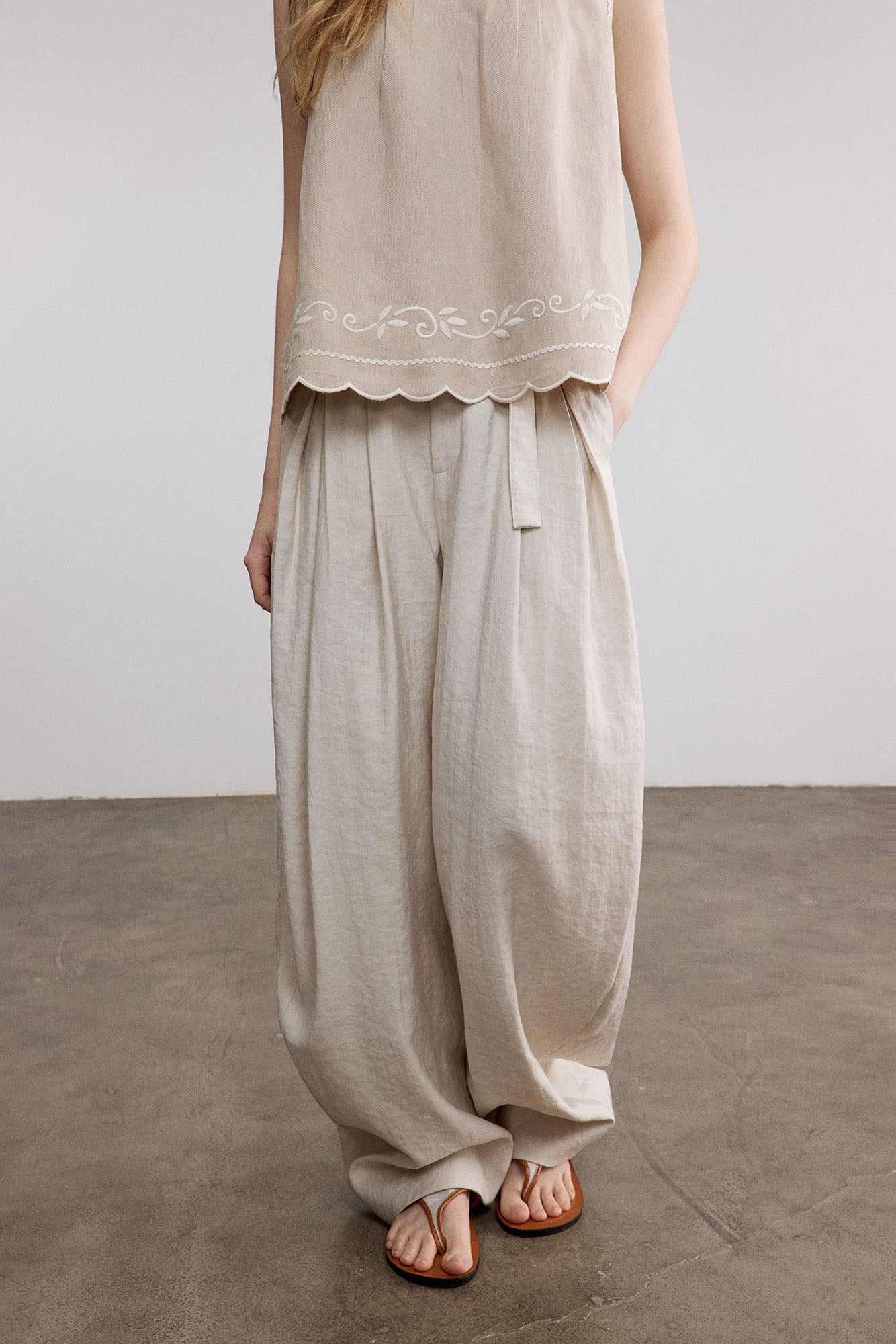 SAME FLOW Belted Pleated Oversized Barrel Pants