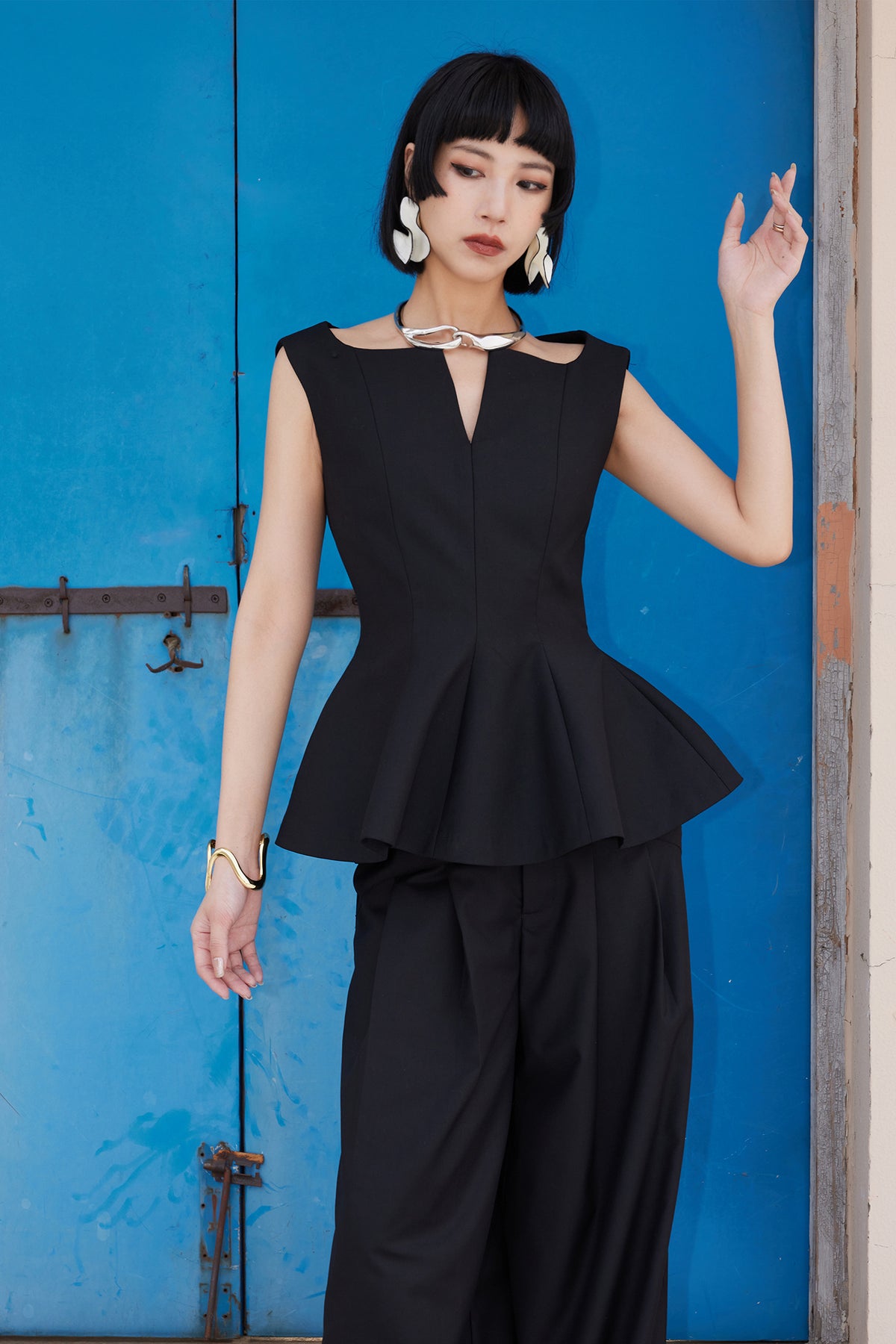 TINY IN STUDIO Sculptural Flared-Hem Tank Top