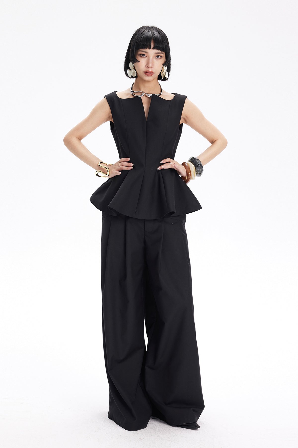 TINY IN STUDIO Sculptural Flared-Hem Tank Top